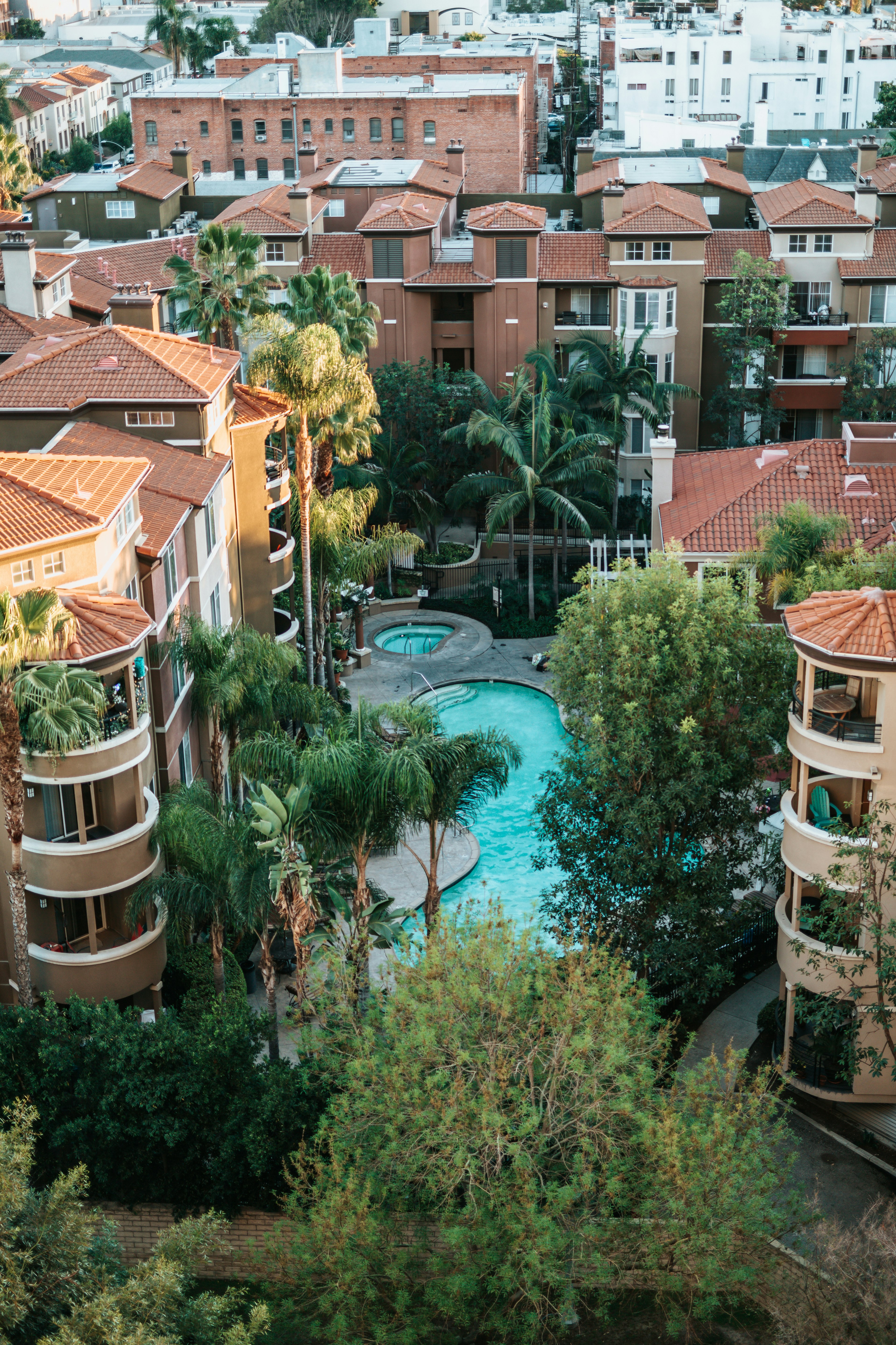 aerial view of buildings near swimming pool